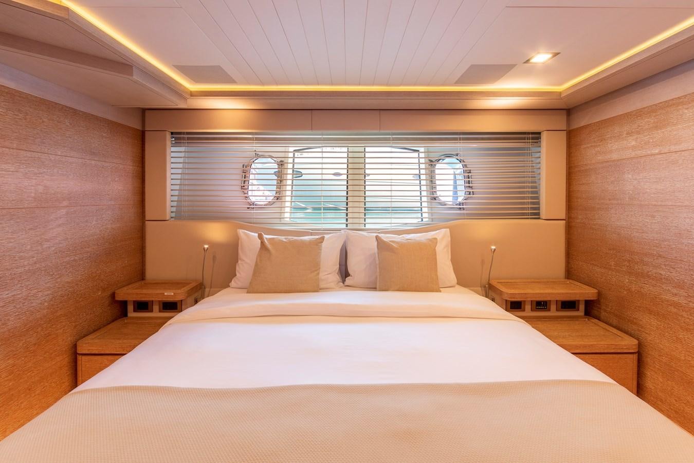 a bed with white sheets aboard CENTURION Yacht for Sale
