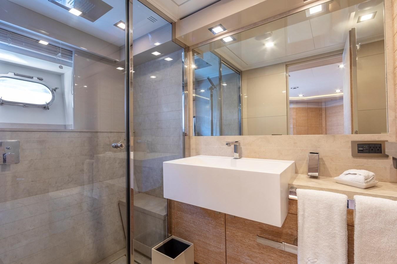 a bathroom with a large glass shower aboard CENTURION Yacht for Sale
