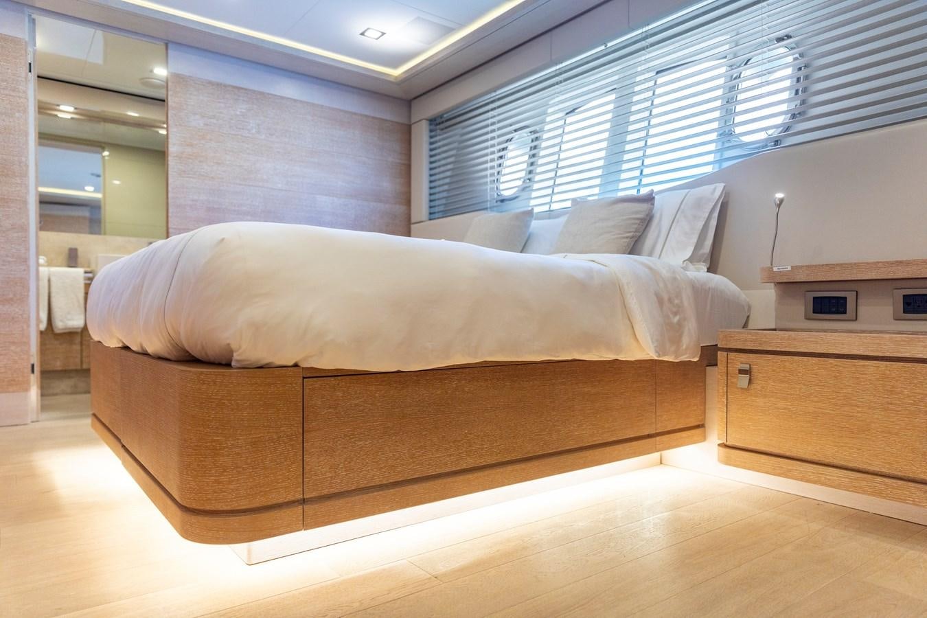 a bed in a room aboard CENTURION Yacht for Sale