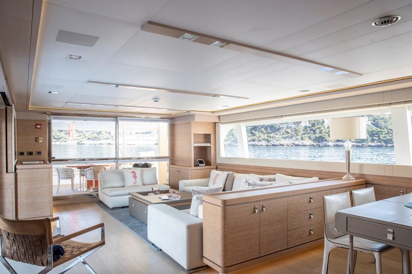 a living room with a large window aboard CENTURION Yacht for Sale