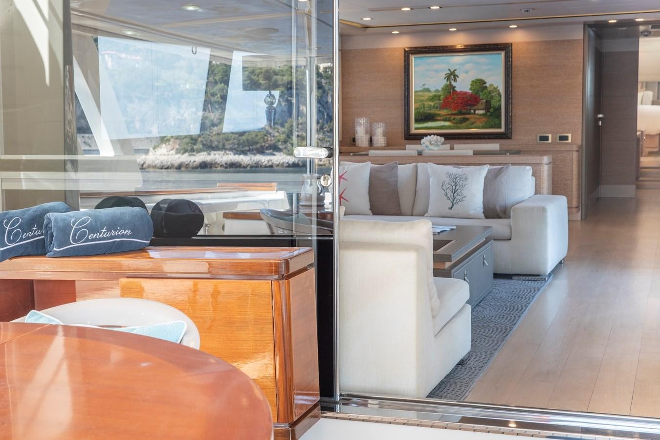 a living room with a large window aboard CENTURION Yacht for Sale