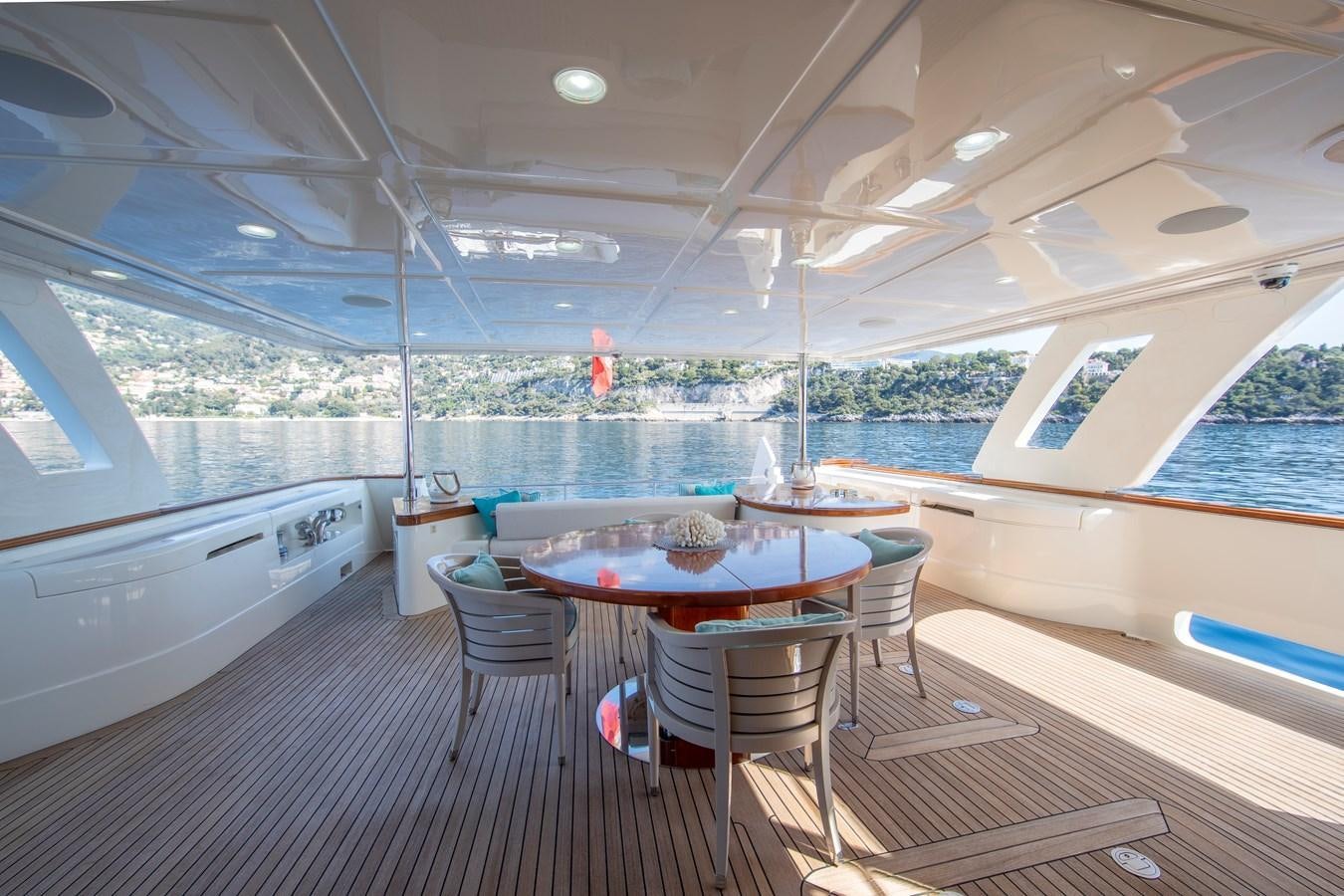 a room with a table and chairs aboard CENTURION Yacht for Sale