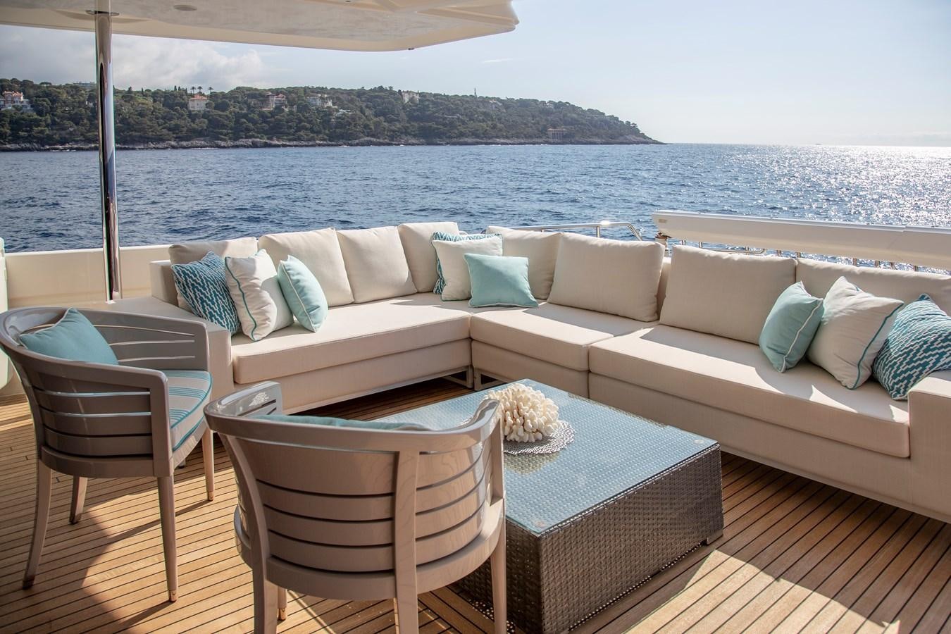 a couch and chairs on a deck aboard CENTURION Yacht for Sale