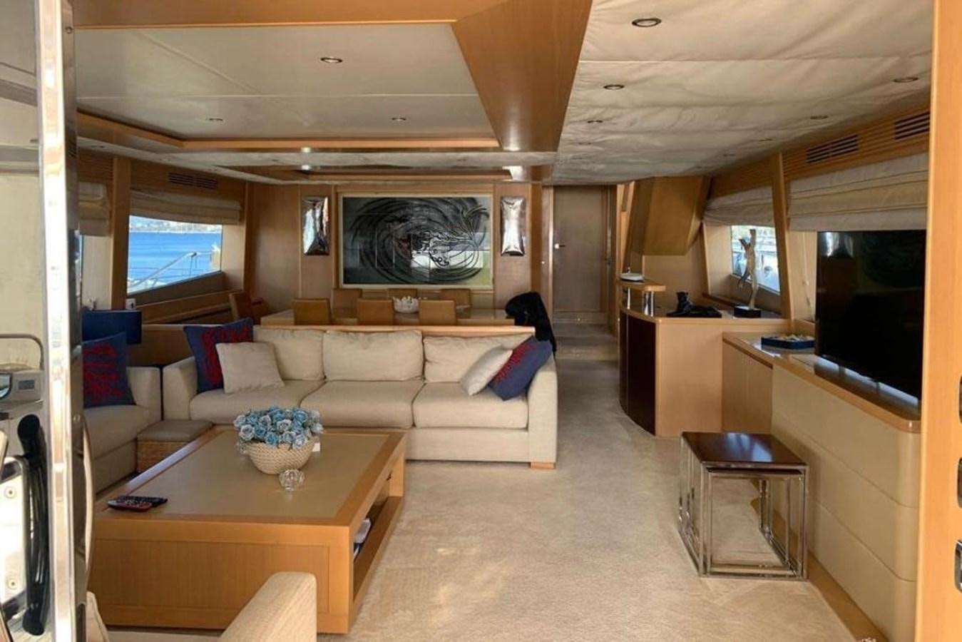 a living room with a couch and a coffee table aboard PRINCESS 95 Yacht for Sale