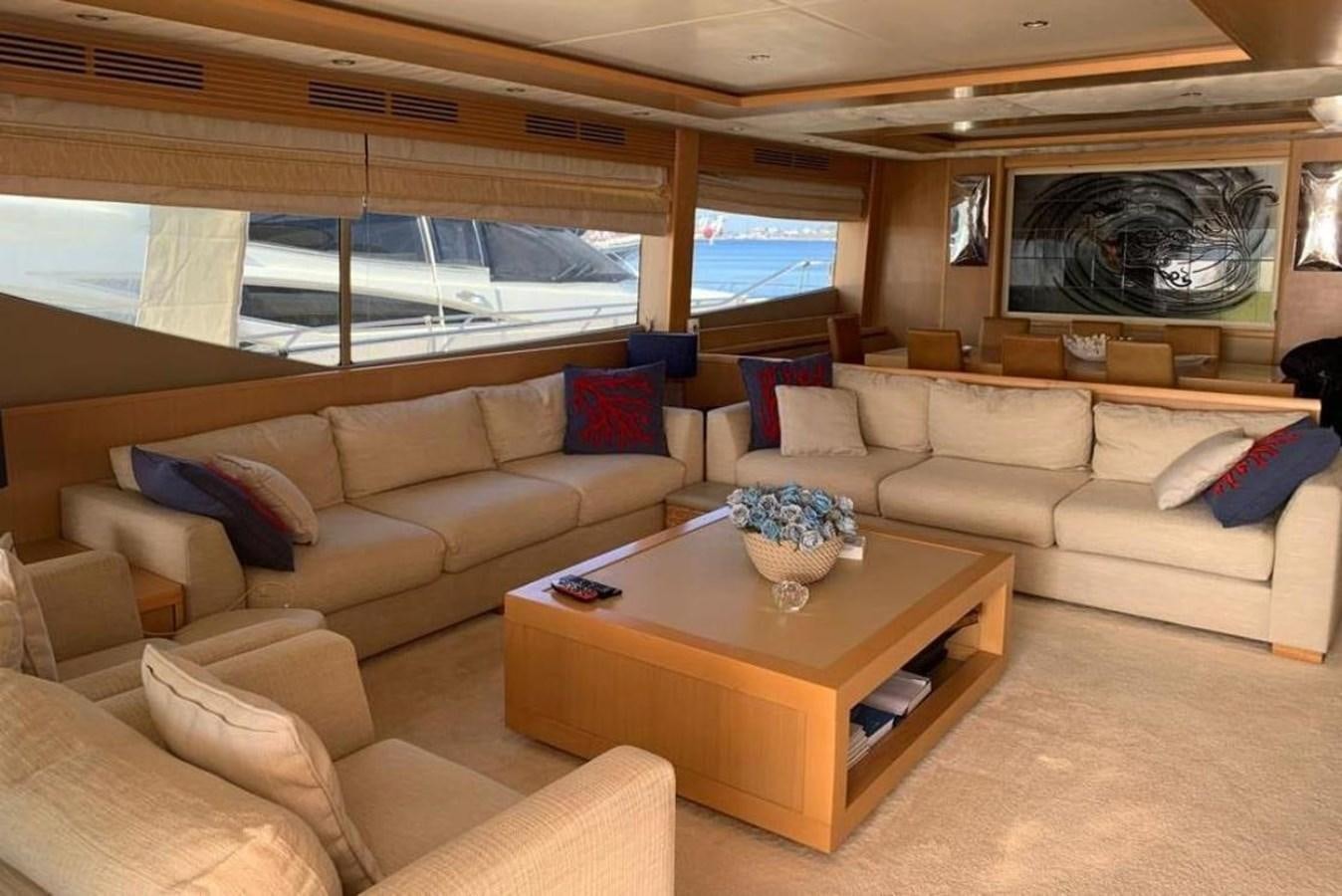 a living room with a large window aboard PRINCESS 95 Yacht for Sale