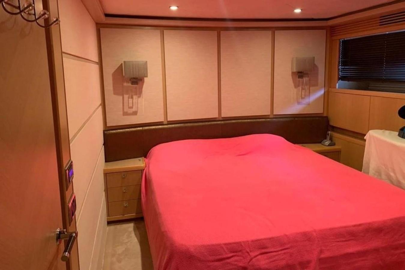 a room with a bed and a window aboard PRINCESS 95 Yacht for Sale