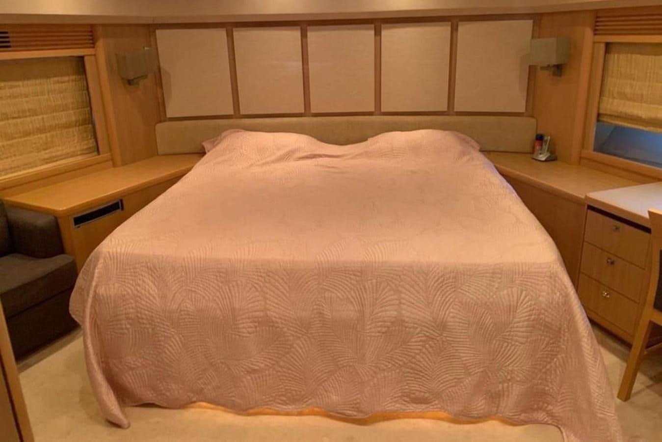 a bed in a room aboard PRINCESS 95 Yacht for Sale