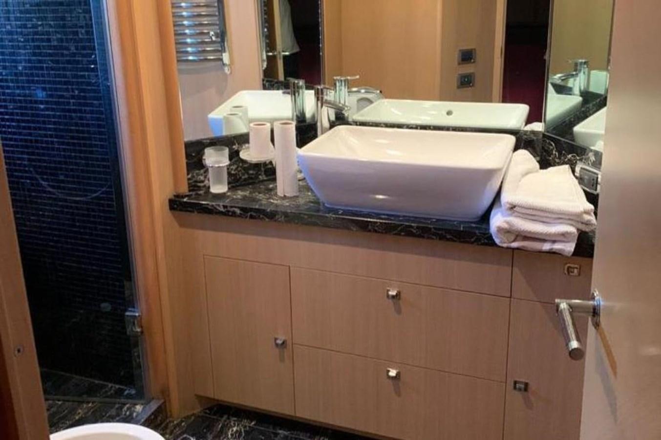 a bathroom with a sink and a mirror aboard PRINCESS 95 Yacht for Sale