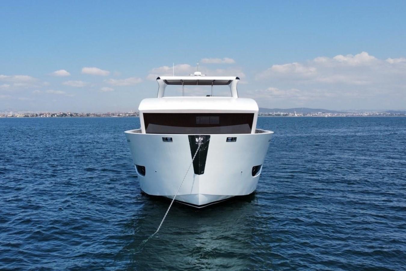 a white boat in the water aboard CARBO Yacht for Sale