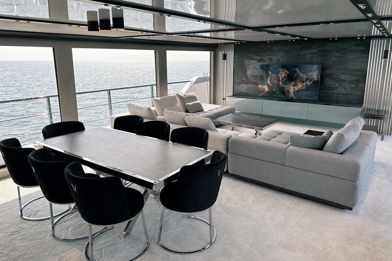 a room with a couch and a table and a tv aboard CARBO Yacht for Sale