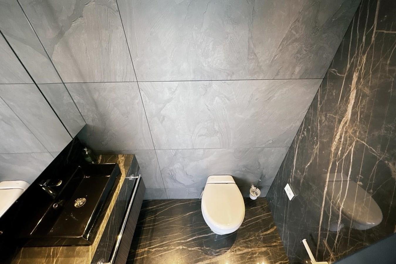 a toilet in a bathroom aboard CARBO Yacht for Sale