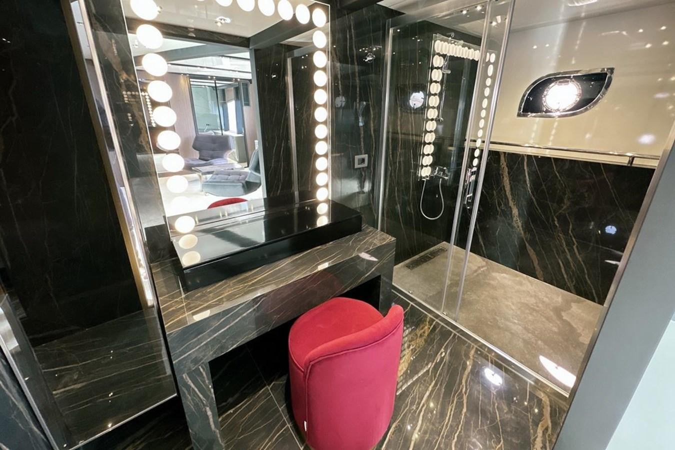 a bathroom with a large mirror aboard CARBO Yacht for Sale