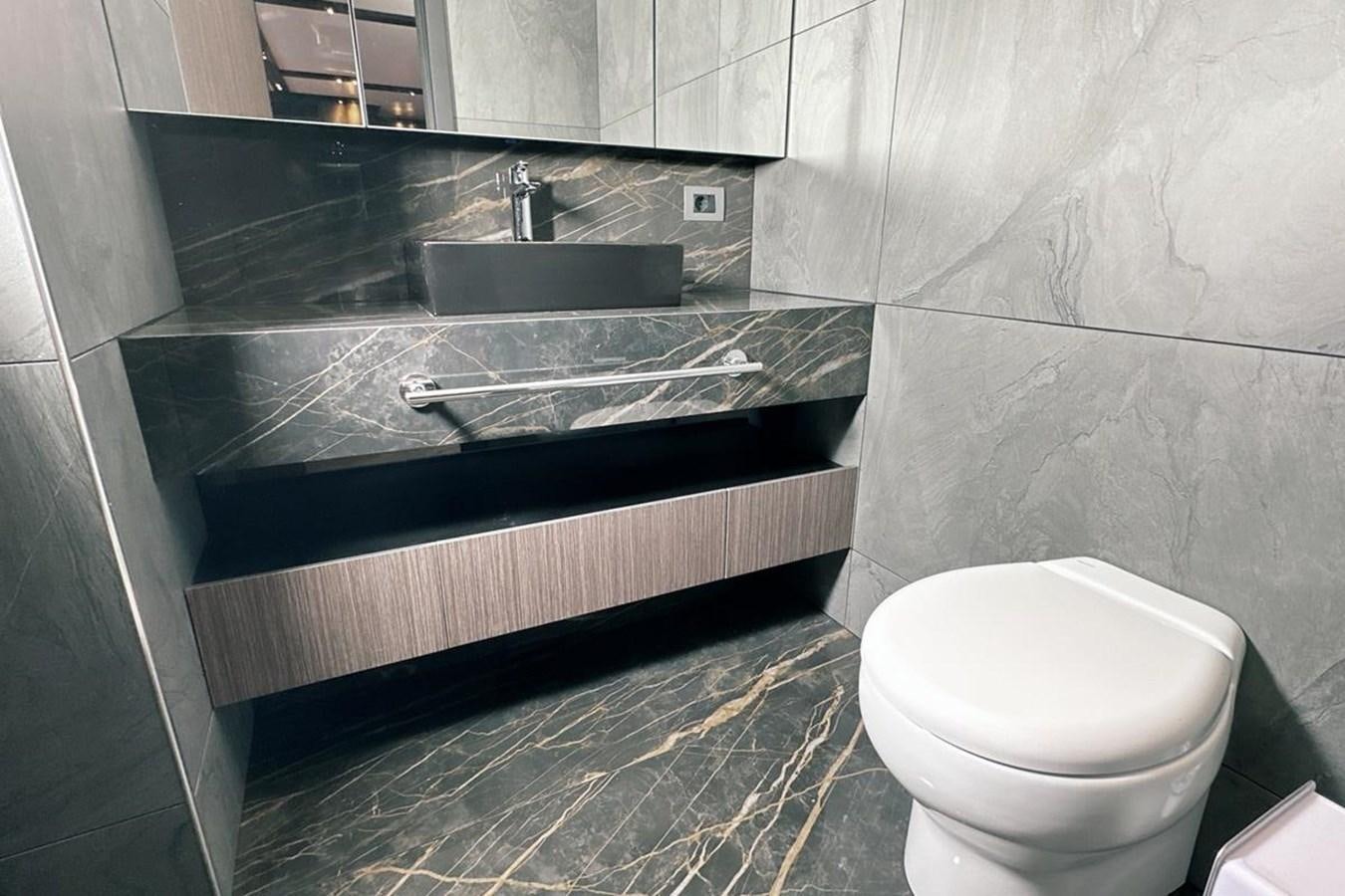 a bathroom with a sink and a toilet aboard CARBO Yacht for Sale