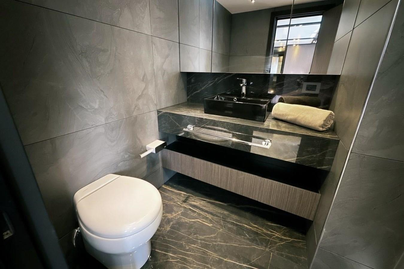 a bathroom with a sink and a toilet aboard CARBO Yacht for Sale