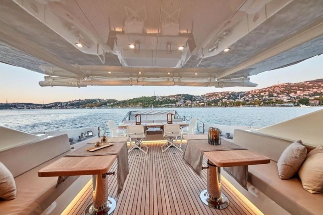 a room with a table and chairs aboard AZIMUT 98 Yacht for Sale