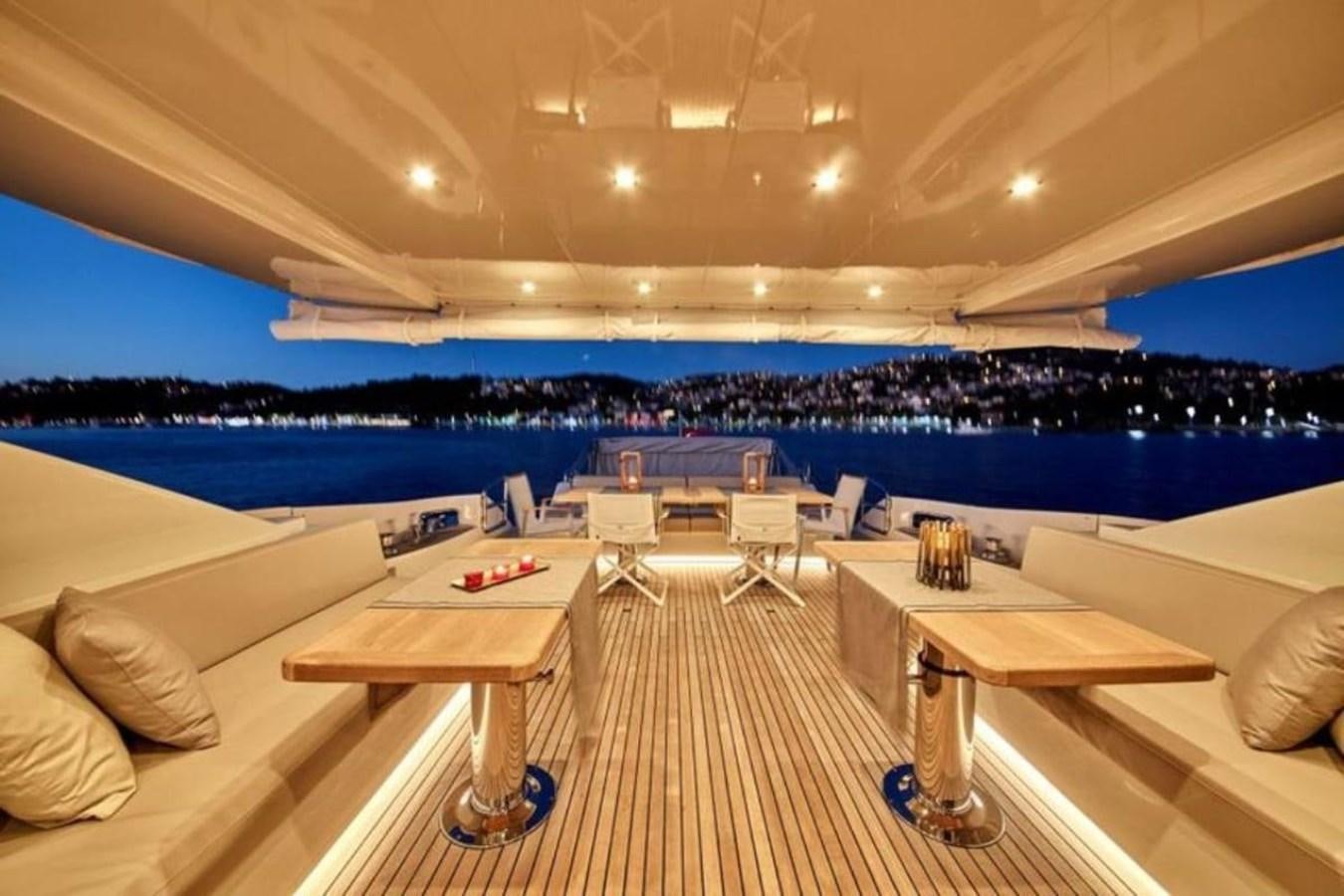 a room with a table and chairs aboard AZIMUT 98 Yacht for Sale