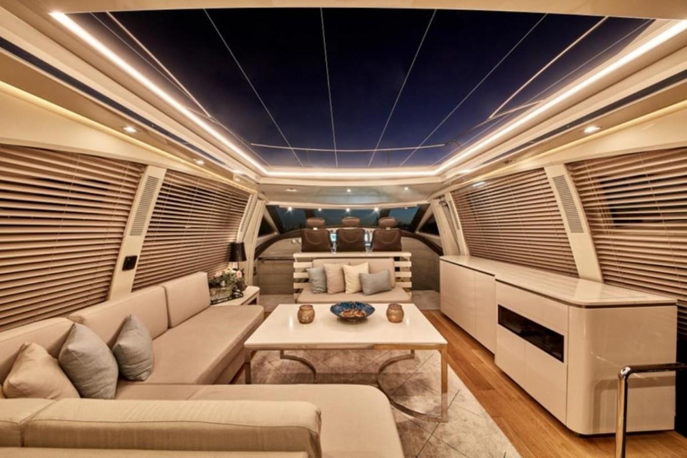 a room with a couch and a table aboard AZIMUT 98 Yacht for Sale