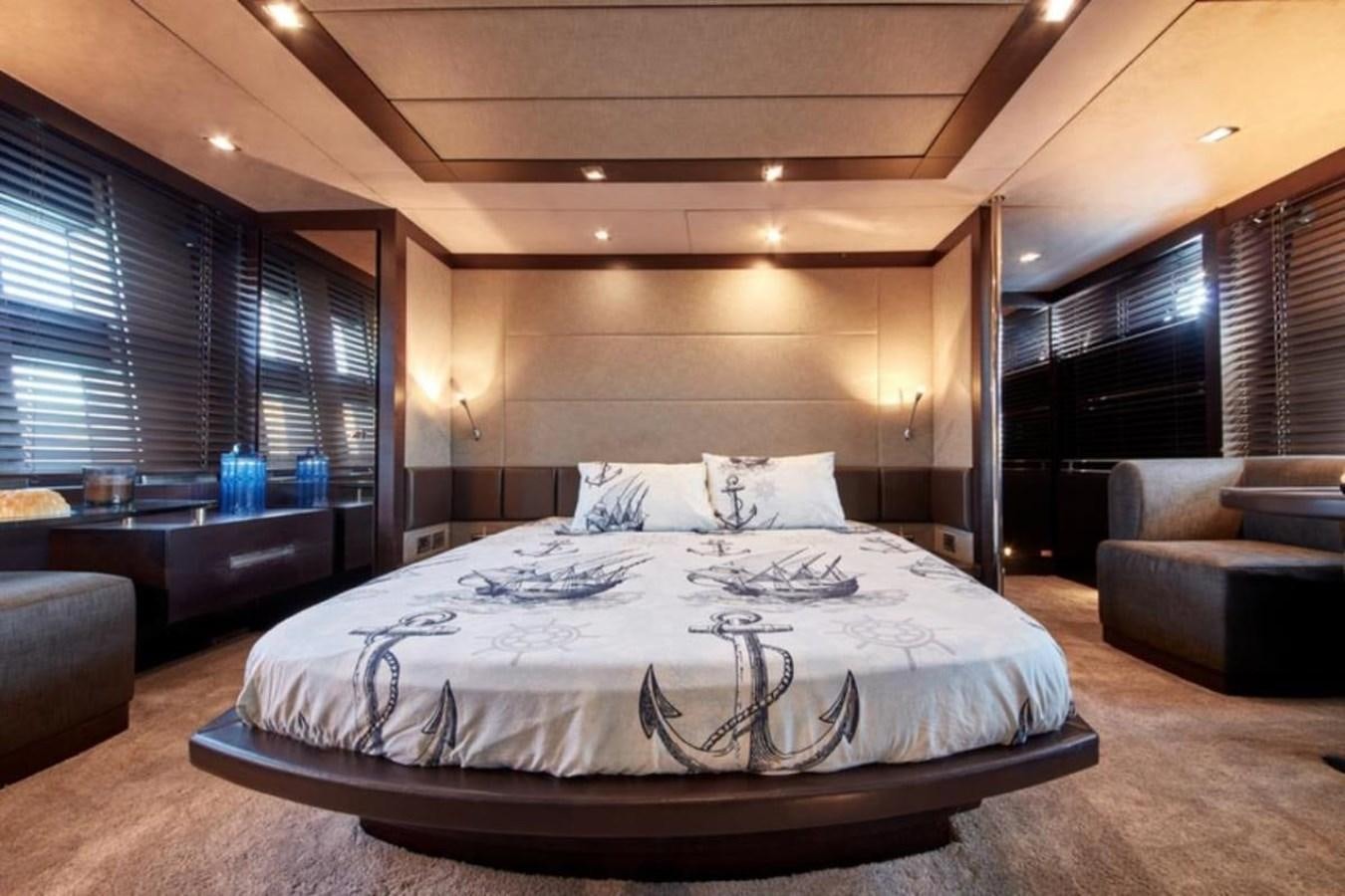a large bed in a room aboard AZIMUT 98 Yacht for Sale