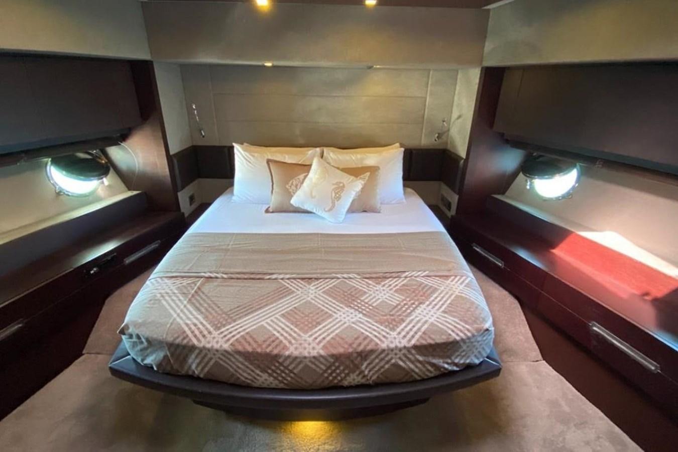 a bed with a pillow aboard AZIMUT 98 Yacht for Sale