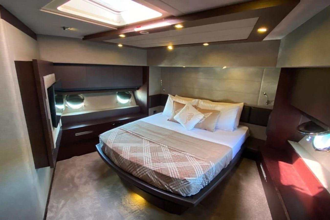 a bed in a room aboard AZIMUT 98 Yacht for Sale