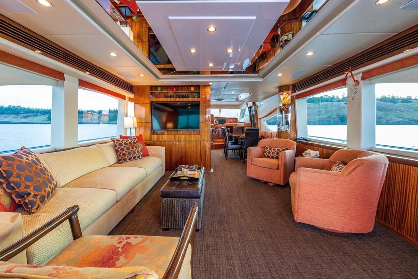 a living room with a large window aboard BELLA SOGNO Yacht for Sale