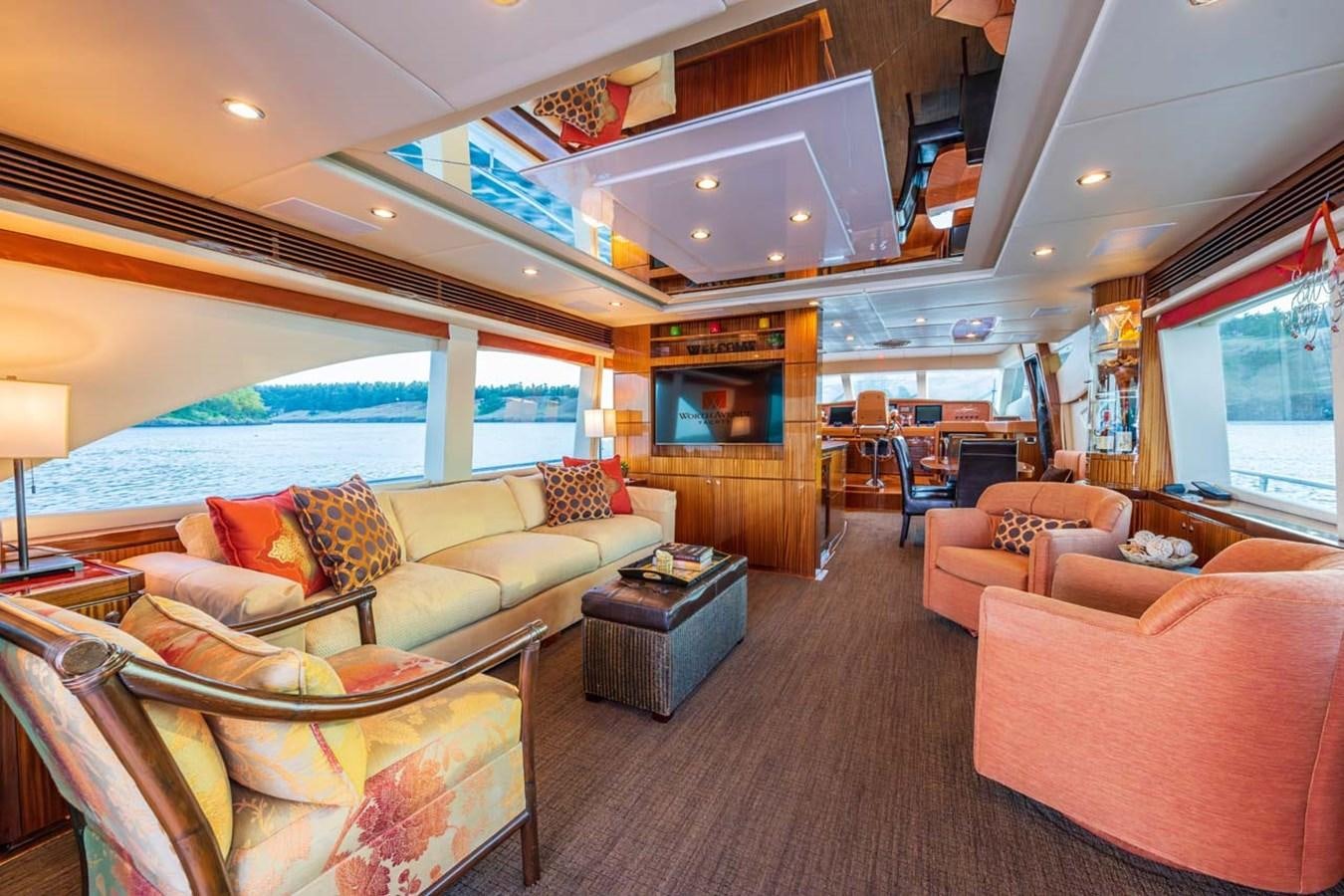 a living room with a large bed aboard BELLA SOGNO Yacht for Sale