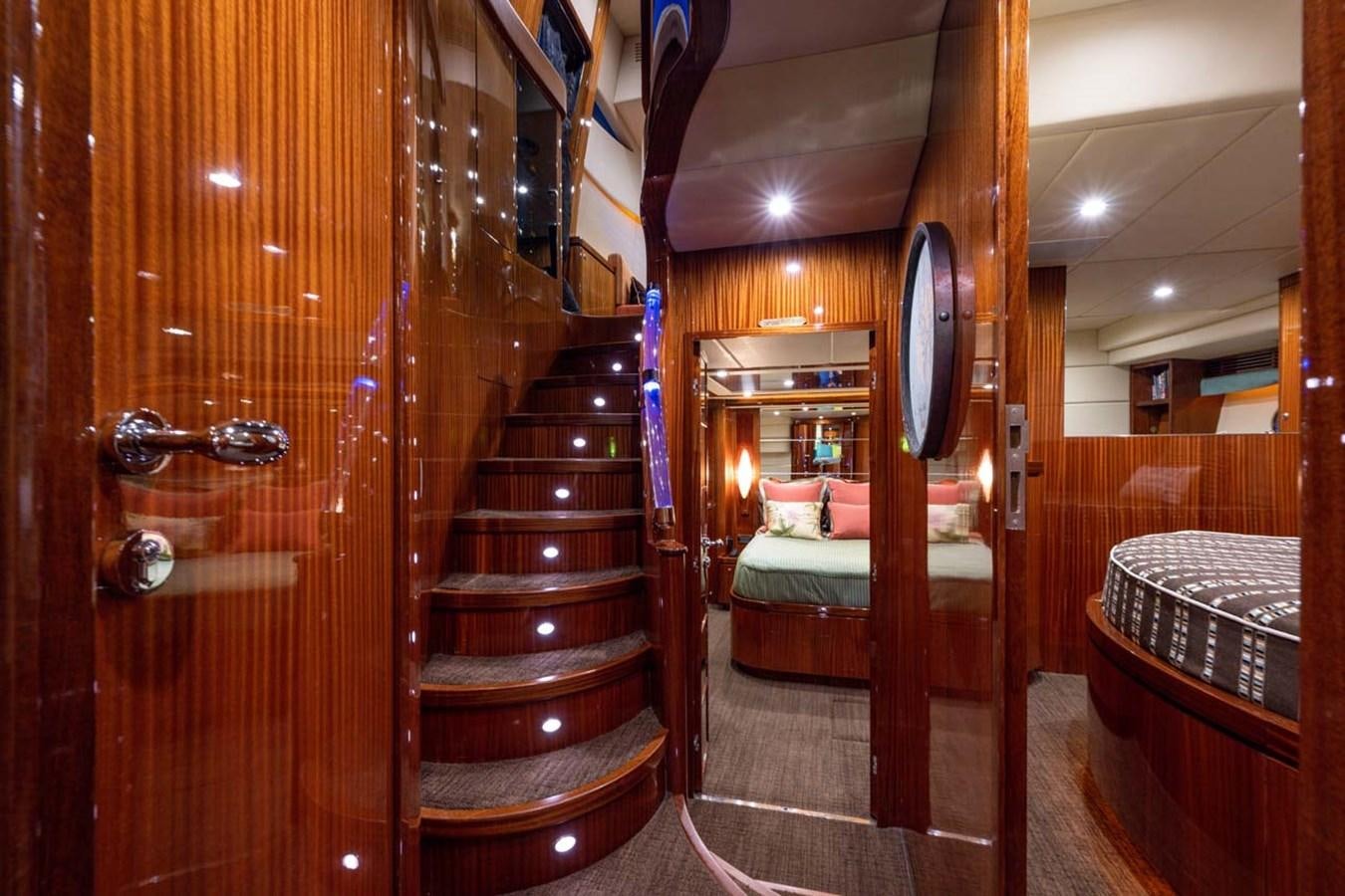 a room with a bed and a mirror aboard BELLA SOGNO Yacht for Sale