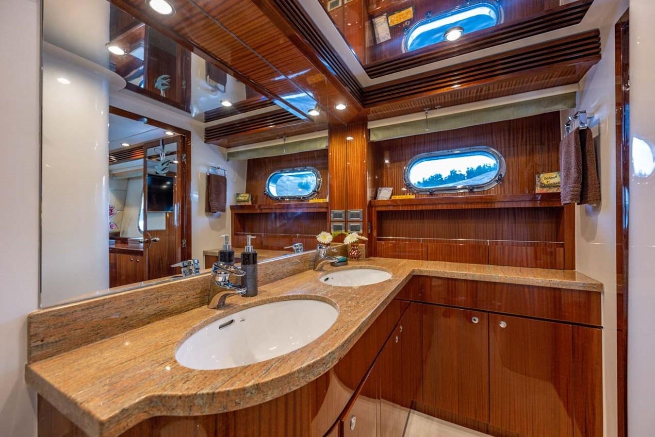 a bathroom with a countertop sink and a large mirror aboard BELLA SOGNO Yacht for Sale