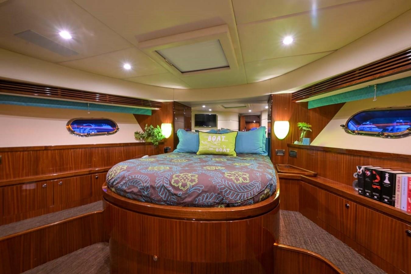 a room with a bed and a television aboard BELLA SOGNO Yacht for Sale
