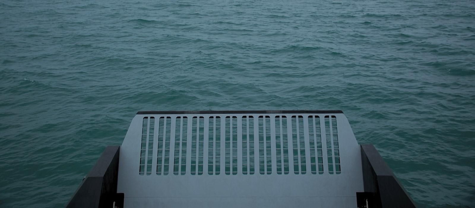 a white balcony overlooking a body of water aboard SUPERFAST 224 Yacht for Sale