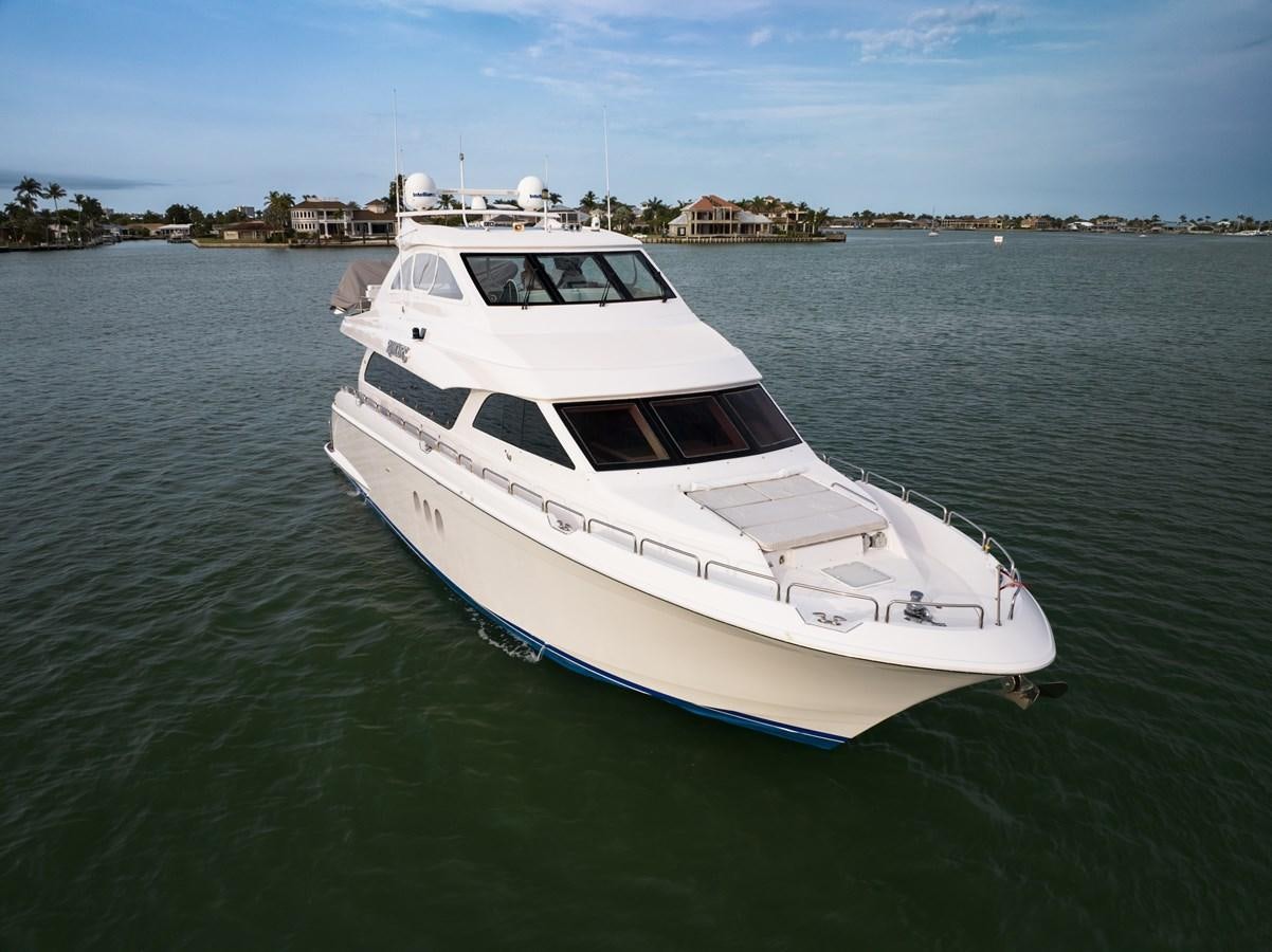 a white boat in the water aboard RUMOURS Yacht for Sale
