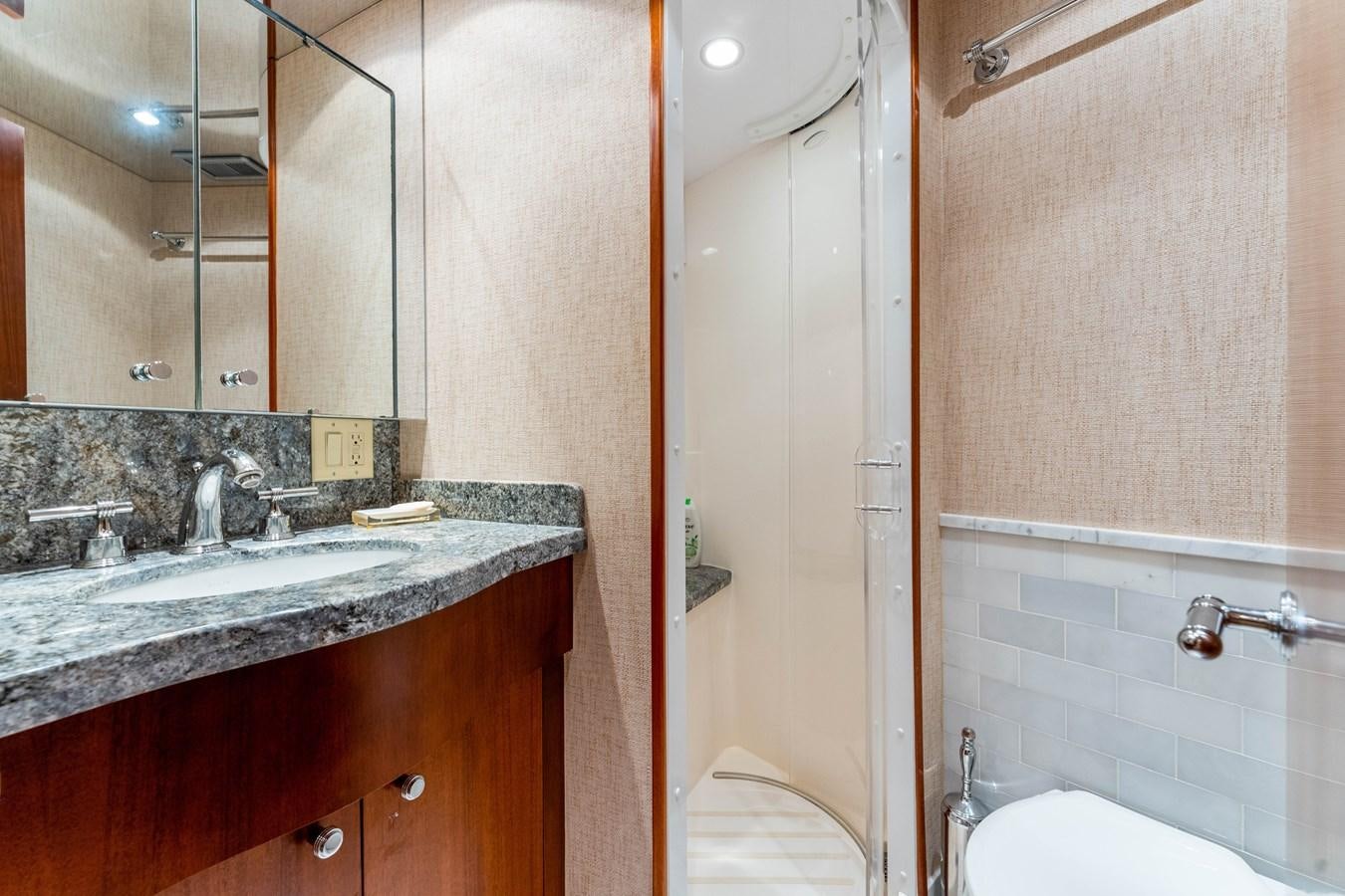 a bathroom with a sink and a bathtub aboard RUMOURS Yacht for Sale