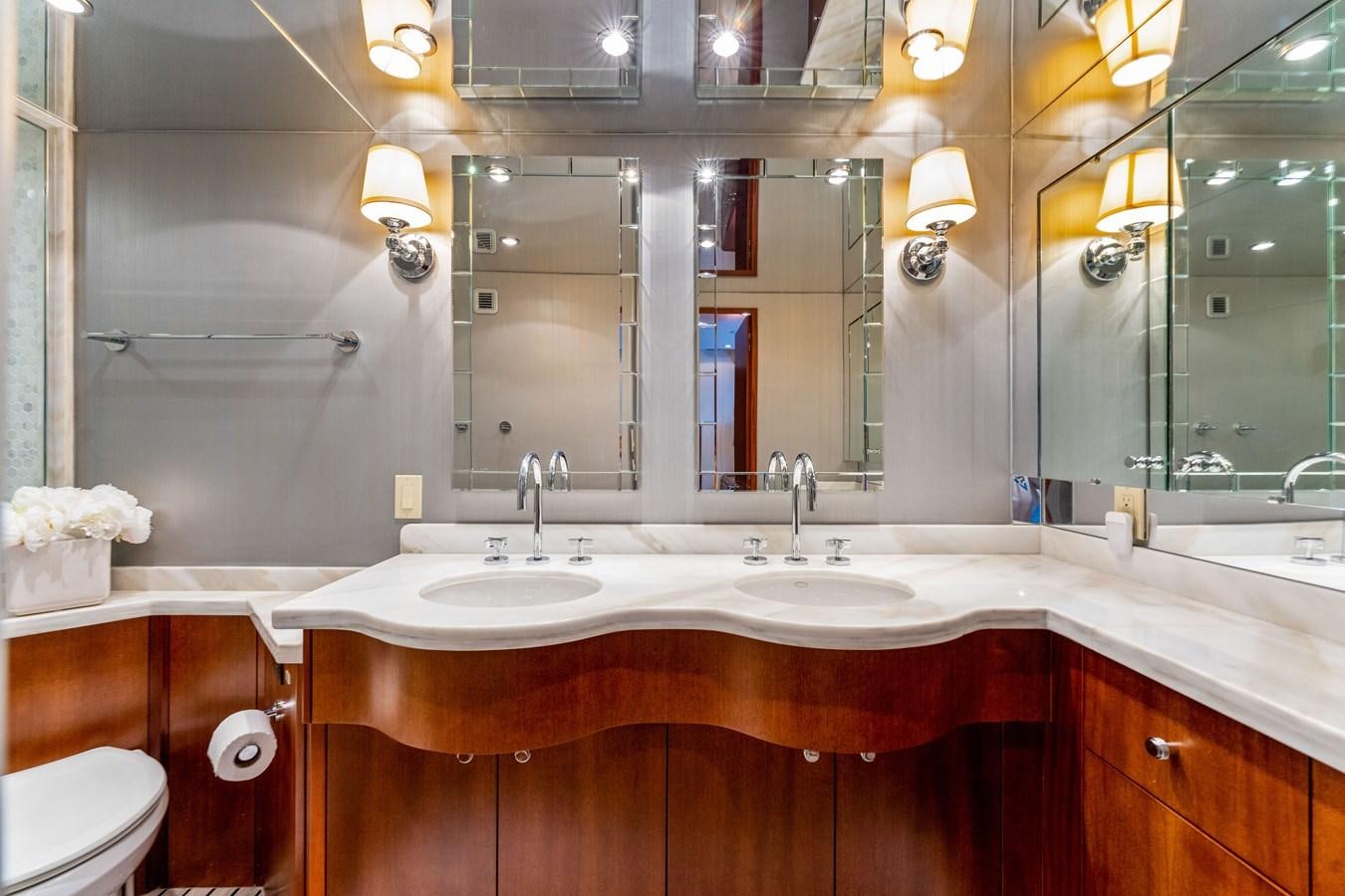 a bathroom with a large mirror aboard RUMOURS Yacht for Sale