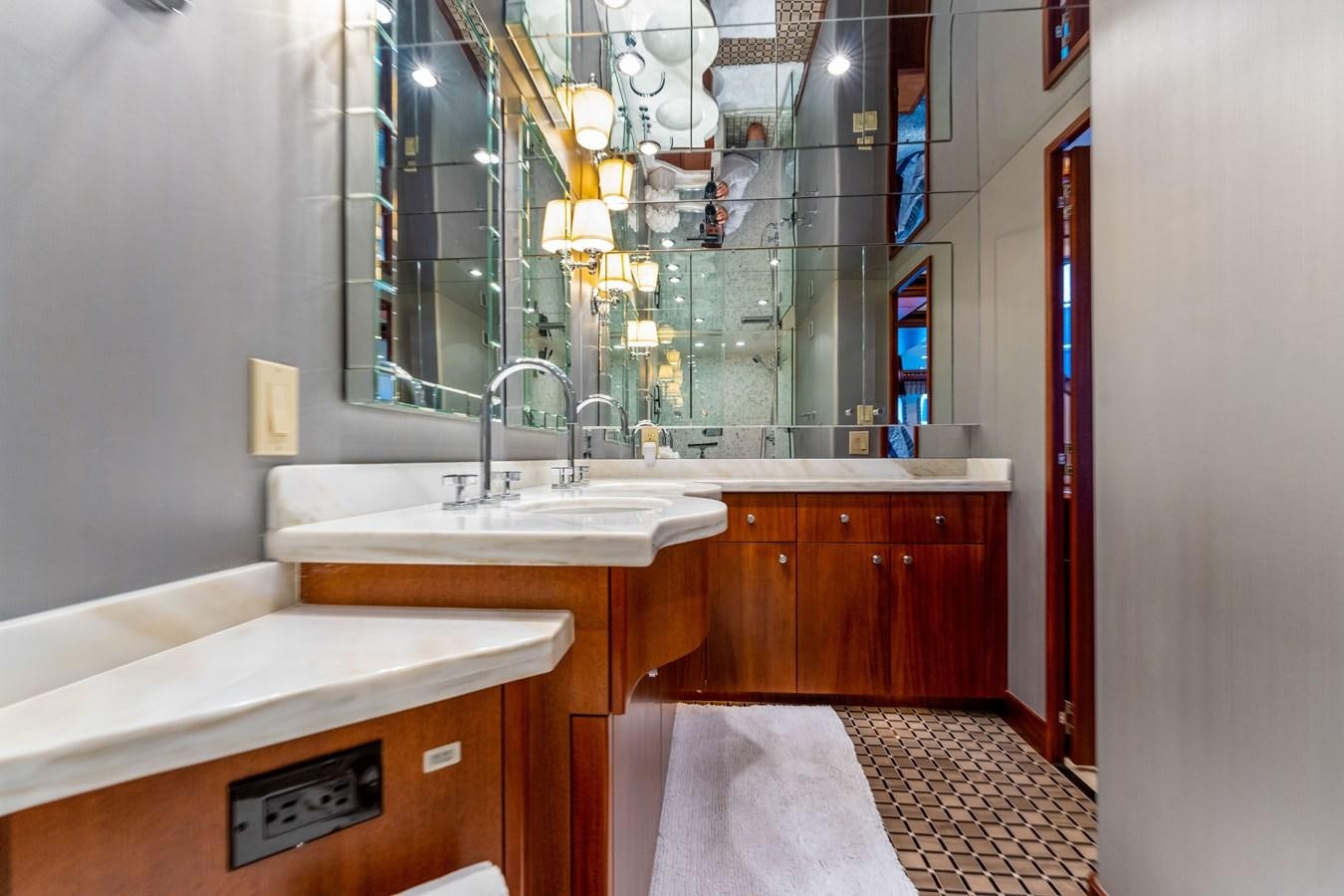 a bathroom with a large mirror aboard RUMOURS Yacht for Sale