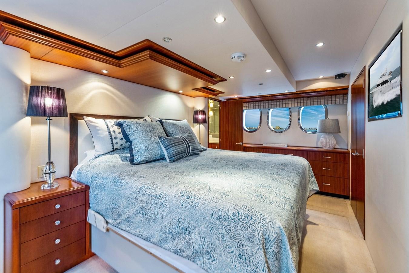 a large bedroom with a large bed aboard RUMOURS Yacht for Sale