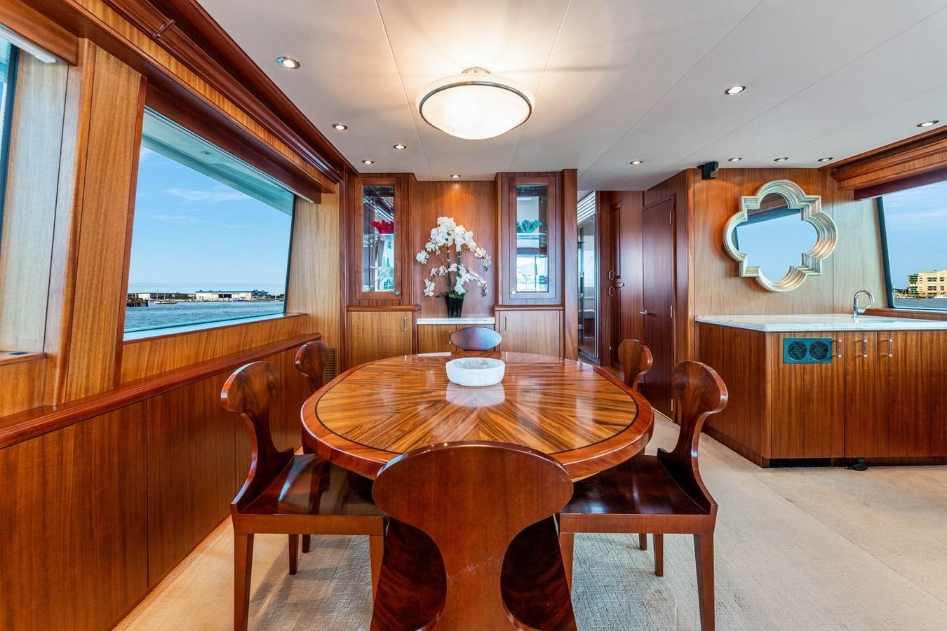 a dining table in a cabin aboard RUMOURS Yacht for Sale