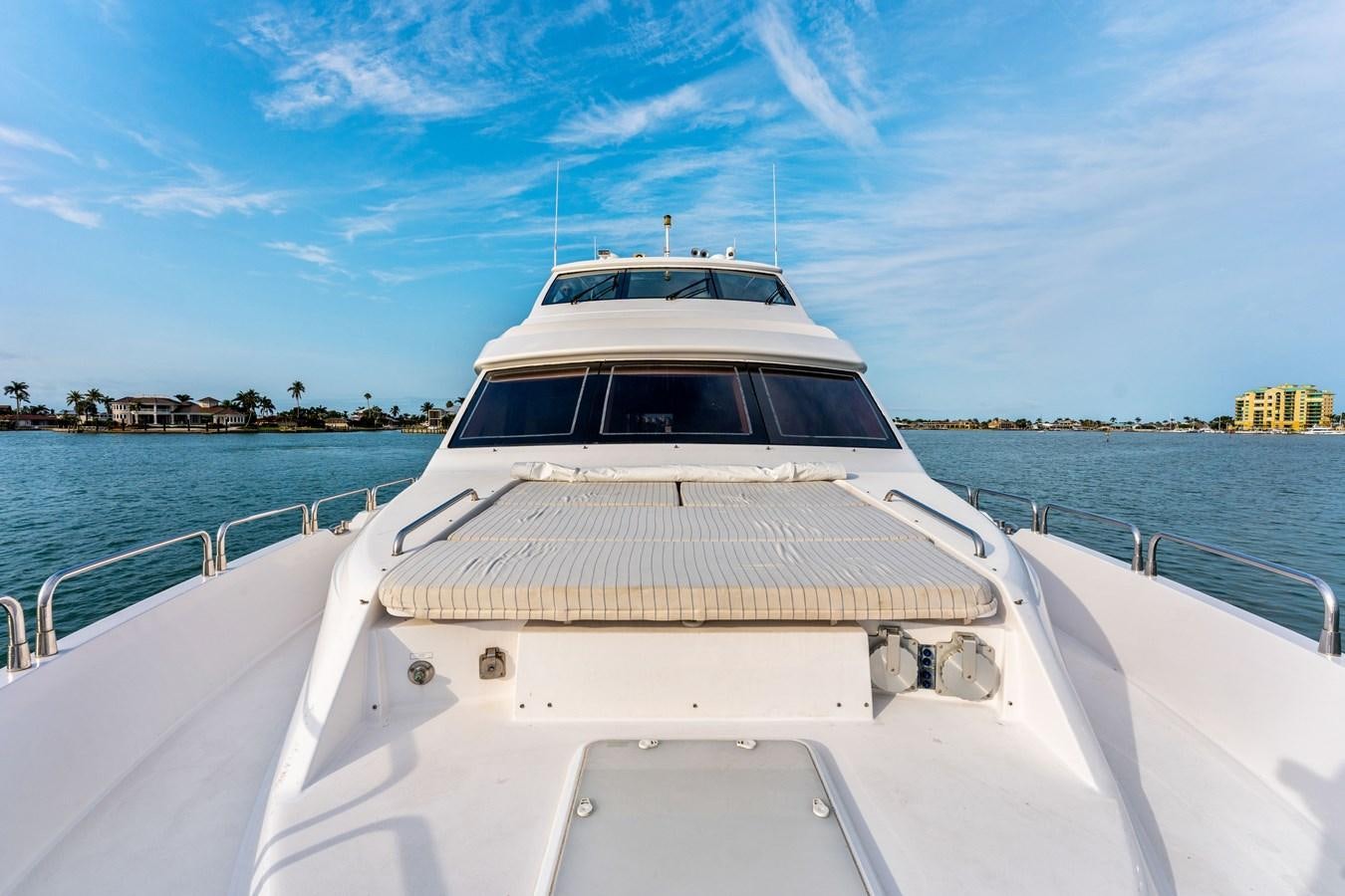 a white boat on a body of water aboard RUMOURS Yacht for Sale