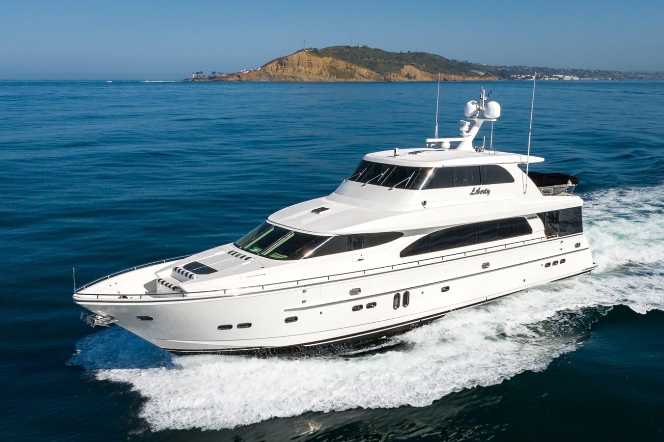 a white yacht on the water aboard LIBERTY Yacht for Sale