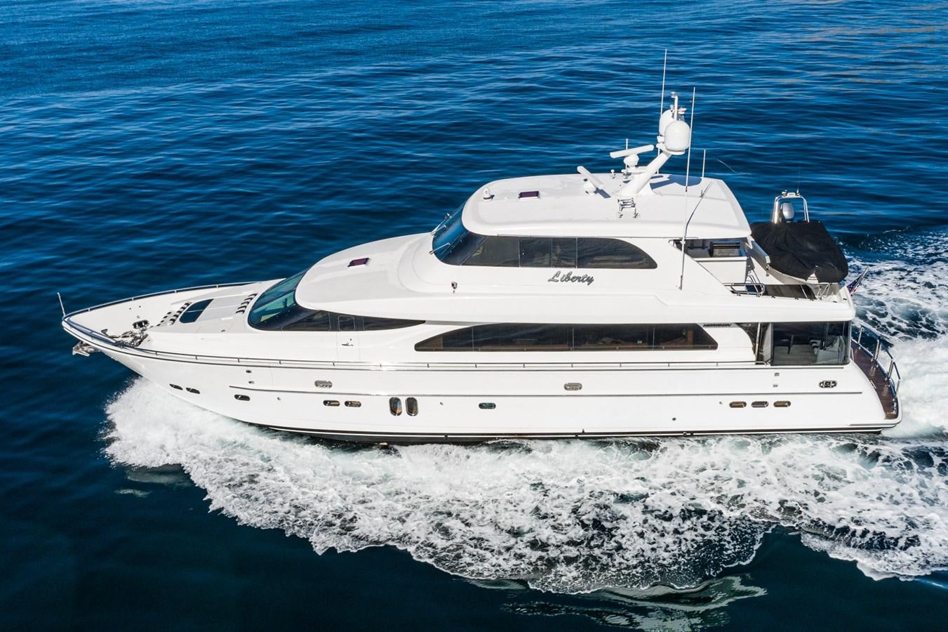 a white yacht on the water aboard LIBERTY Yacht for Sale
