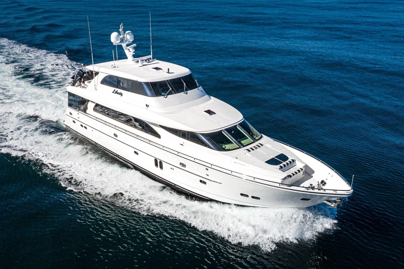 a white yacht on the water aboard LIBERTY Yacht for Sale