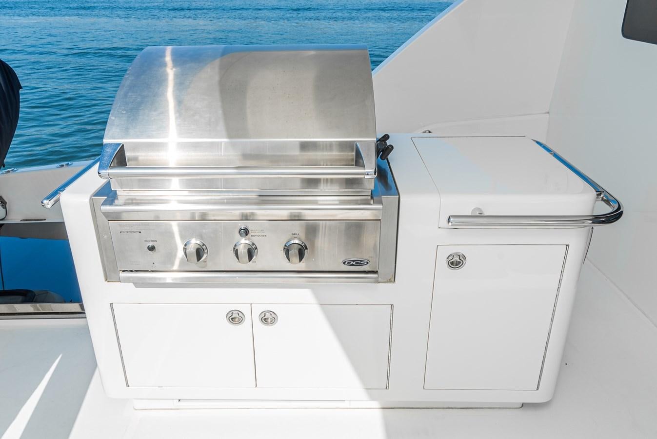 a white machine with a blue handle aboard LIBERTY Yacht for Sale