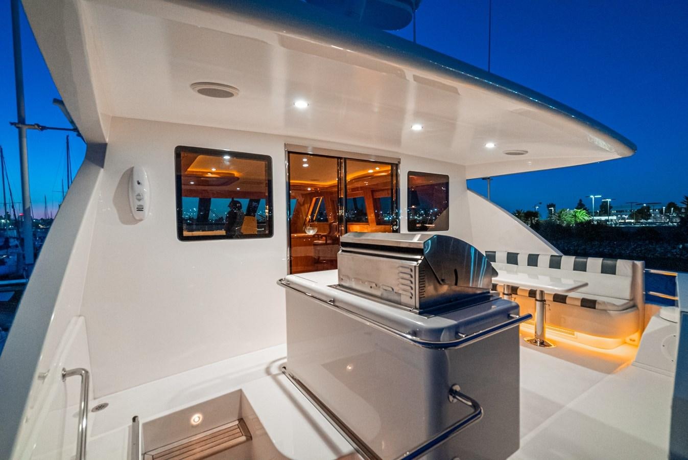 a large white building with a large window and a balcony aboard LIBERTY Yacht for Sale