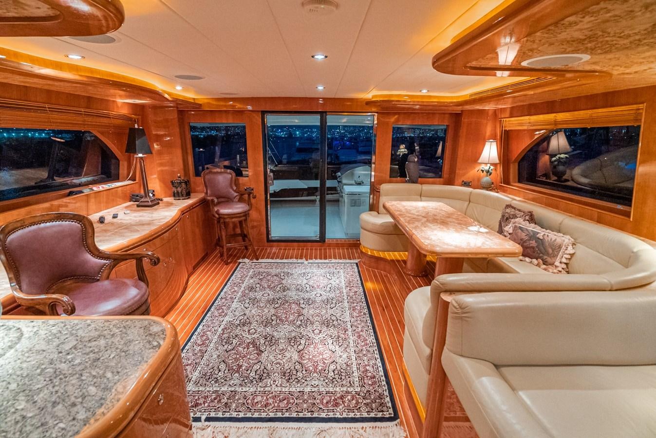 a living room with a fireplace aboard LIBERTY Yacht for Sale