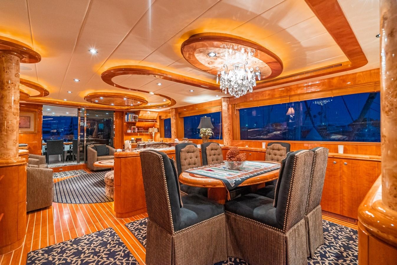 a room with a chandelier and chairs aboard LIBERTY Yacht for Sale