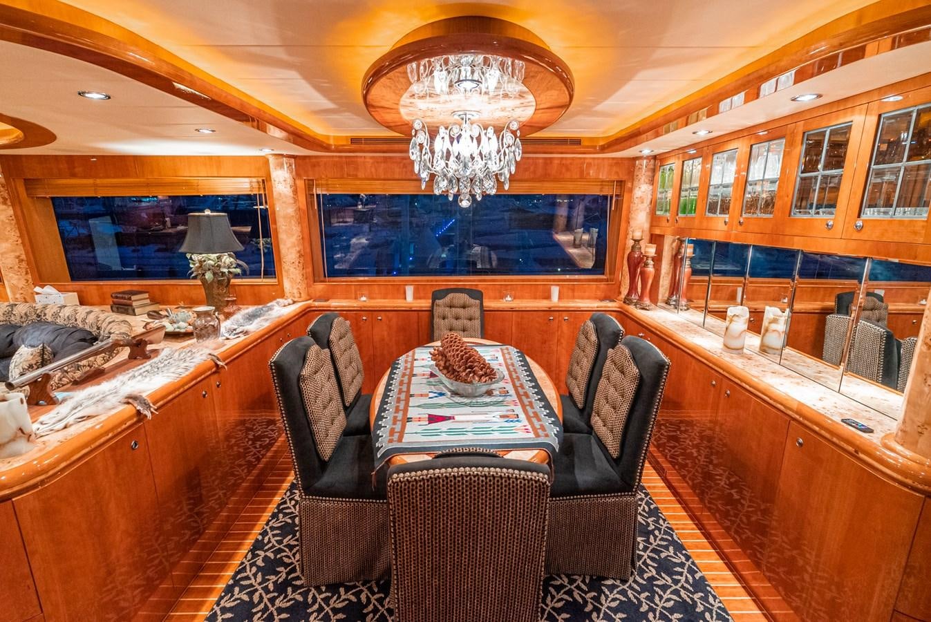 a room with a chandelier and a couch aboard LIBERTY Yacht for Sale