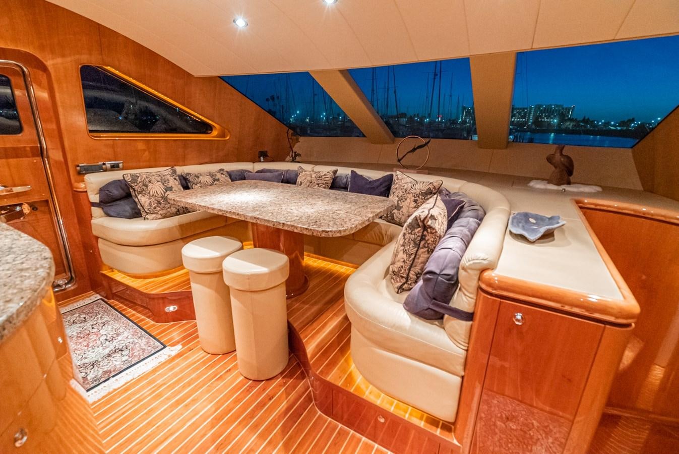 a room with a bed and a table aboard LIBERTY Yacht for Sale