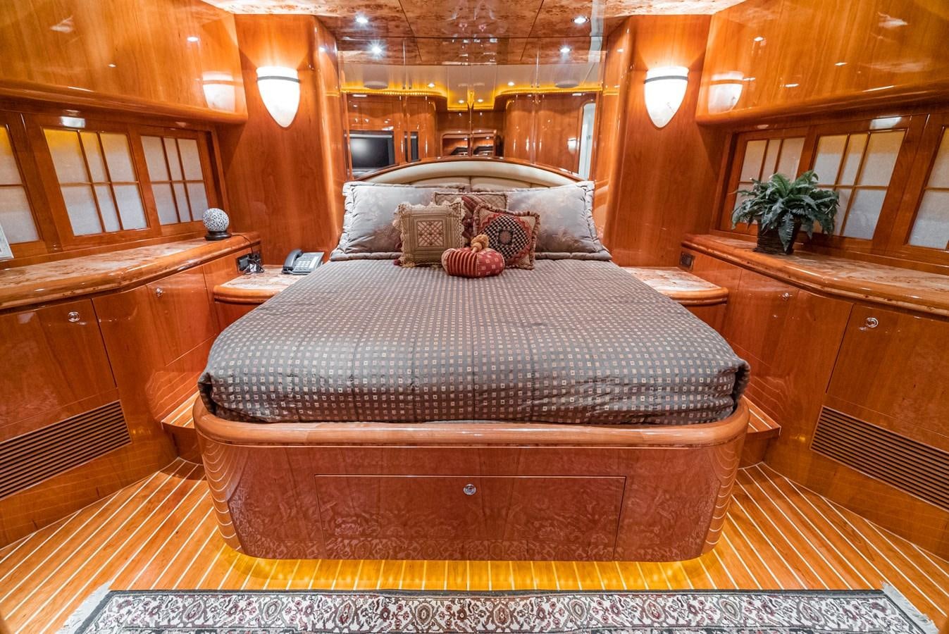 a large bed in a room aboard LIBERTY Yacht for Sale