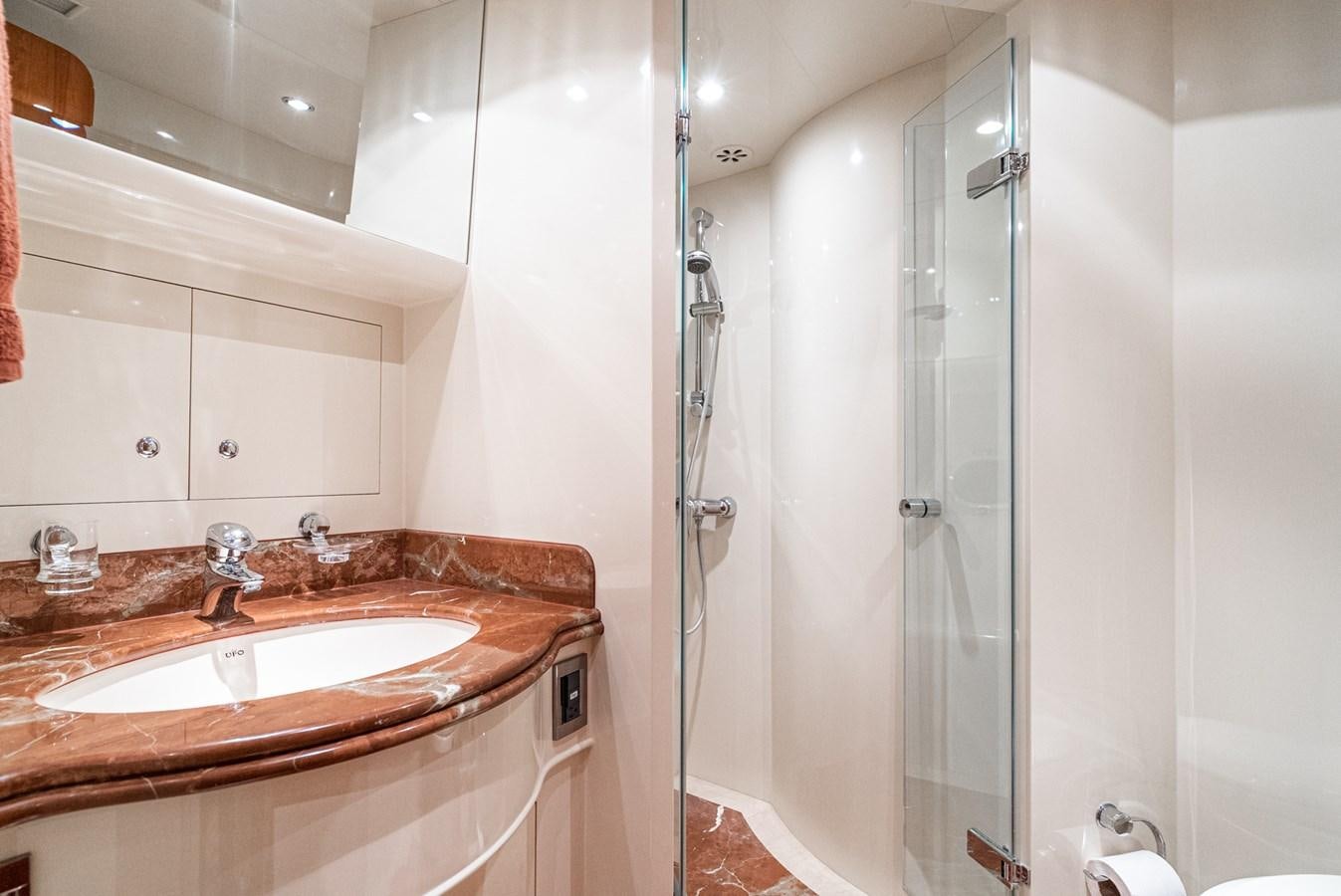 a bathroom with a shower and sink aboard LIBERTY Yacht for Sale