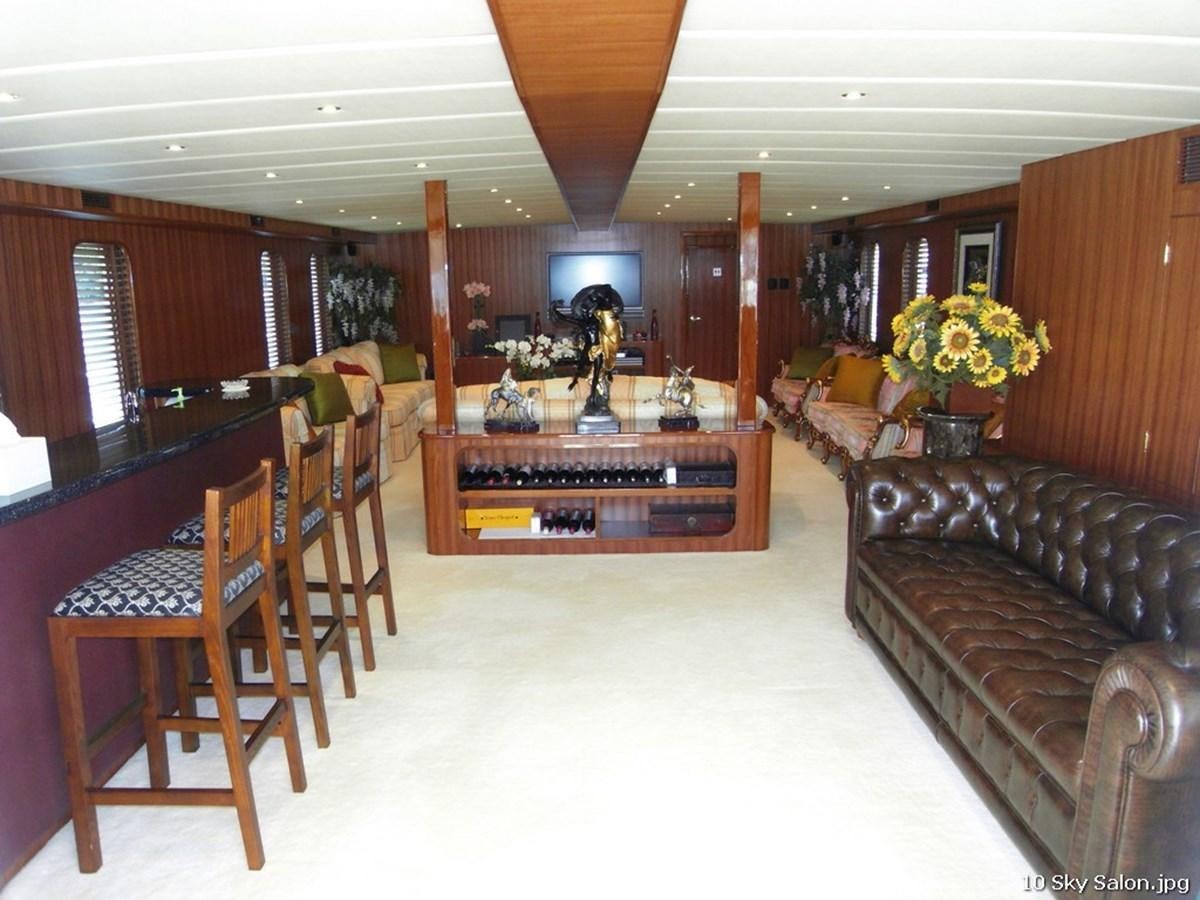 a large room with wooden furniture aboard WESTERN ISLES Yacht for Sale
