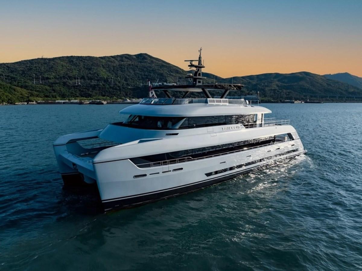 a white yacht on the water aboard SPACECAT Yacht for Sale